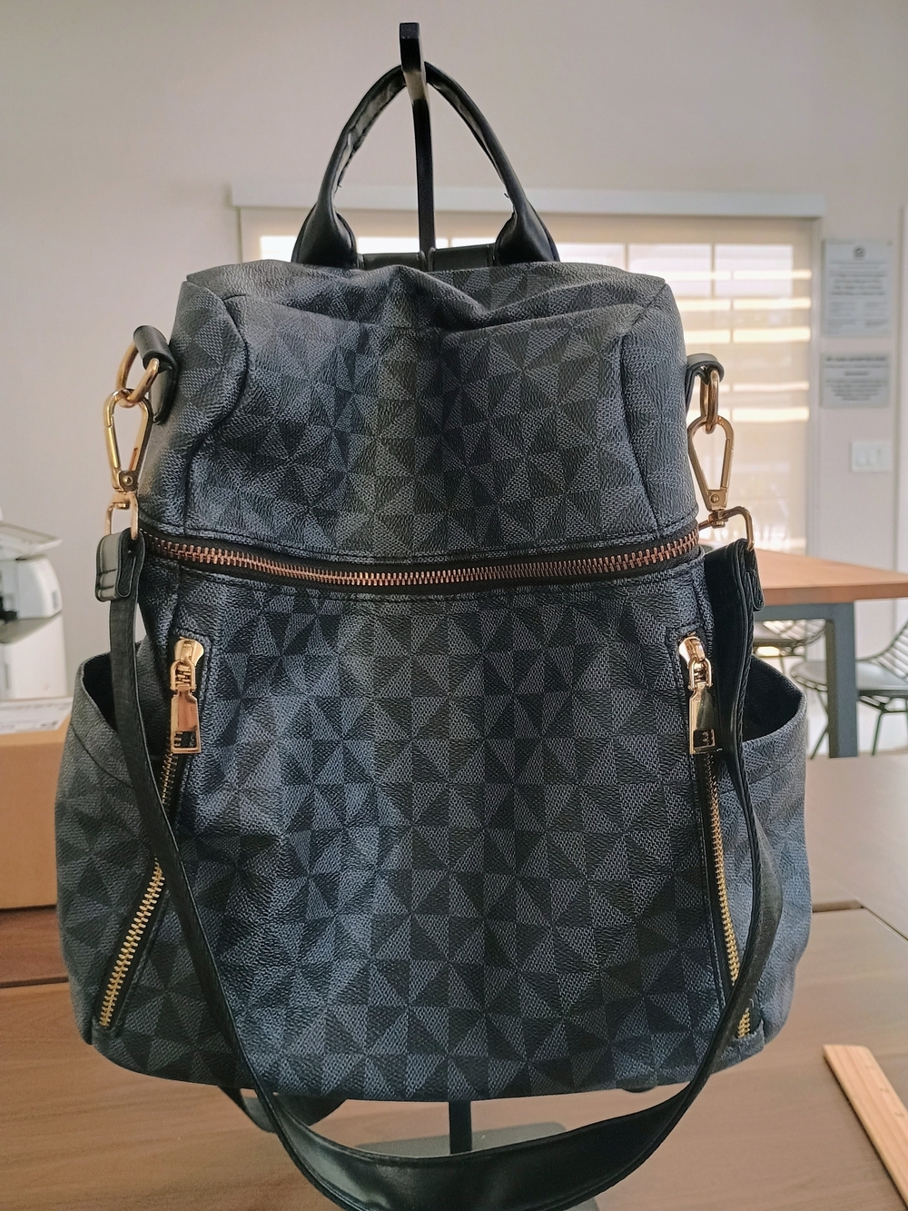 Stylish Black Geometric Women's Backpack with Gold Hardware